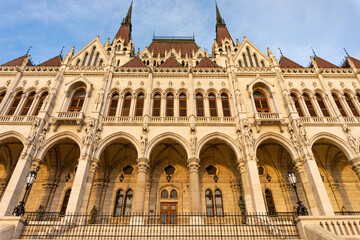Fototapeta na wymiar The Hungarian Parliament building. View of the main facade and south entrance during golden hour. Situated on Kossuth Square in the Pest side of Budapest, on the eastern bank of the Danube.