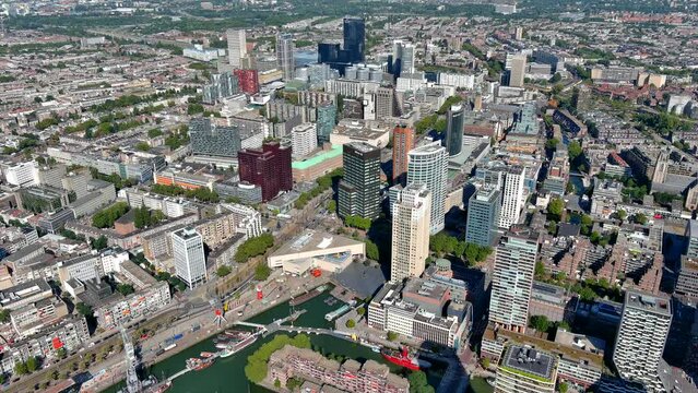Rotterdam from above in Netherlands ft. new aerial skyline of the city center around business financial district, flying along the skyscrapers in the Dutch province of South Holland