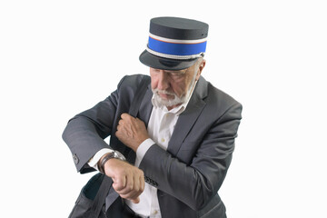 The train conductor looks at his wristwatch while waiting for the train to depart. Isolated. On a...