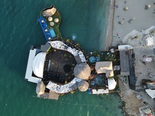 Aerial view of Zrce Beach Festival in Novalja, island Pag, archipelago of Croatia. People partying on a hot summer day on Zrce beach. Zrce beach is the most popular party destination on Adriatic sea.