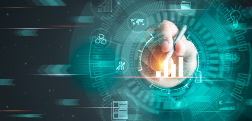 Businessman hand holding a pen is analyzing business, future big data analysis technology concept on VR screen, data management and business marketing and financial reports to optimize development.