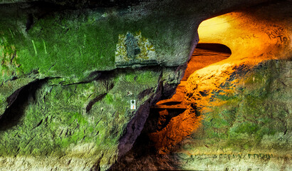 illuminated cave in Romania pestera bolii