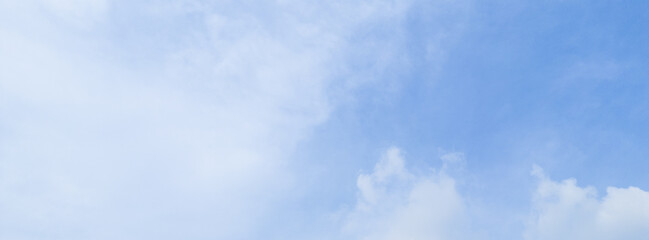Fototapeta premium Abstract blue sky white cloud on the light of the sun background with empty copy space for add text or advertise design creative
