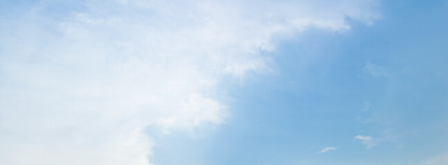 Fototapeta premium Abstract blue sky white cloud on the light of the sun background with empty copy space for add text or advertise design creative