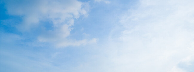 Fototapeta premium Abstract blue sky white cloud on the light of the sun background with empty copy space for add text or advertise design creative