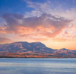 sea cape silhouette at the sunrise, early morning sea scene