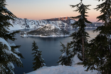 Beautiful sunset view in the Crater Lake in winter. Location is the Crater Lake National Park, Oregon