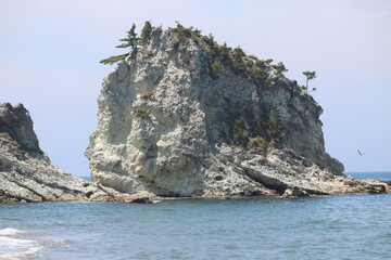 Naklejka premium big white rock and sea