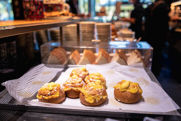 six "Veneziane" an italian morning pastry with cream, in a tray