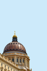 Obraz premium Cover page with famous Berlin Royal Palace dome in historical and business downtown of Berlin, Germany, at blue sky solid background with copy space.