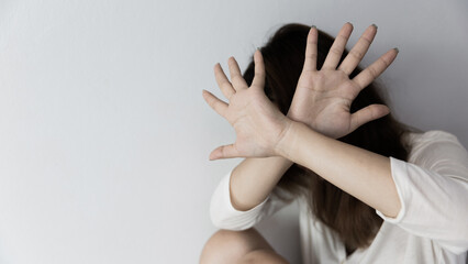 Stop hurting woman! young female person raised her hand for stop violence, sexual abuse, human...
