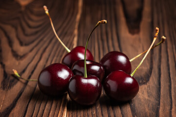 Fresh sweet cherry fruit on wooden background