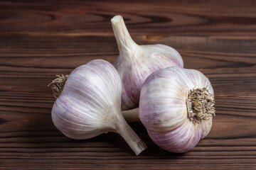 Garlic bulb on wooden background. Close up