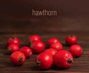 Hawthorn fruits on wooden backgrounds. close up