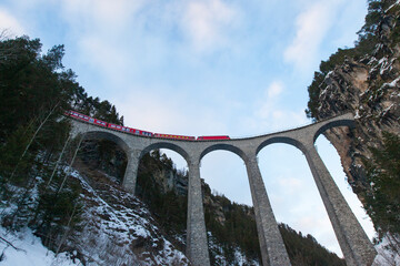 Red Express in the Winter Season, Swiss Alps Grindelwald, Switzerland - obrazy, fototapety, plakaty