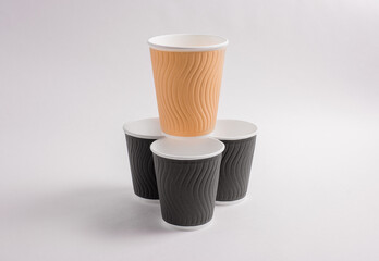 A disposable coffee cup without a lid isolated on a white background