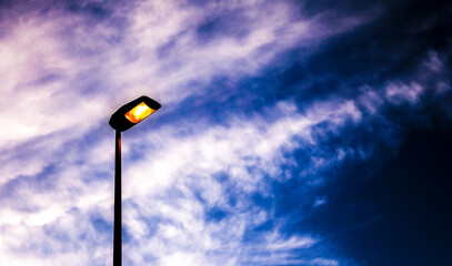 High lamppost in the afternoon at sunset