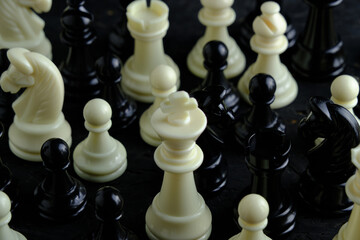 Black and white chess pieces top view.
