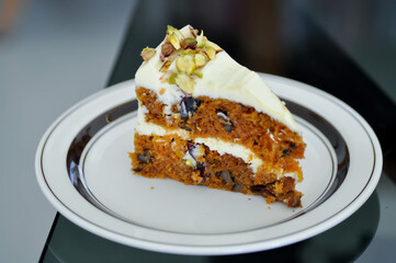 carrot and raisin cake with pistachio topping , carrot cake