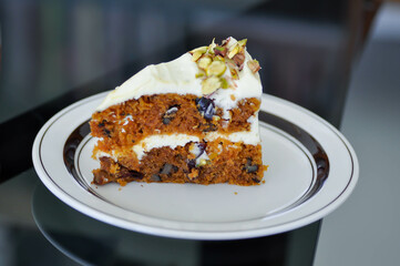 carrot and raisin cake with pistachio topping , carrot cake
