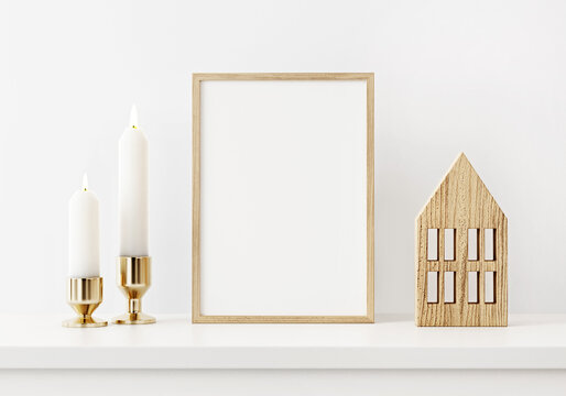 Small Christmas vertical wooden frame mockup in white home interior with minimal decoration. 3D rendering, illustration.