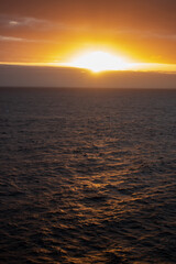 Obraz premium Sunset from the sea water ocean