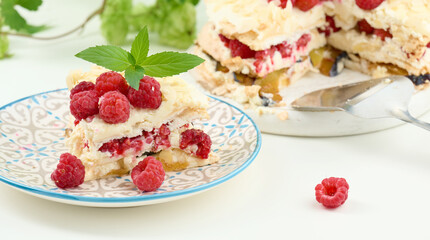 Round meringue pie with fresh raspberries on a white background, Pavlova dessert