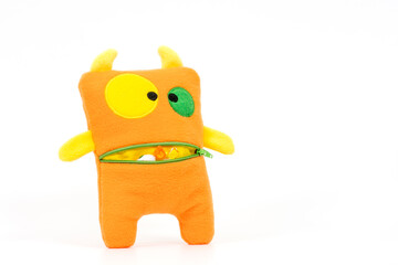 Cute orange toy on a white background