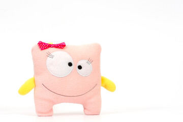 Cute pink toy on a white background