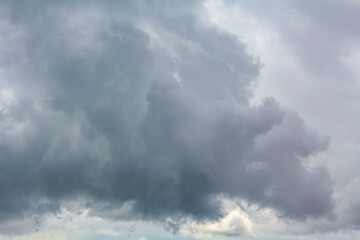 Fototapeta na wymiar Heavy rain thunderstorm dark storm clouds wind in Germany.