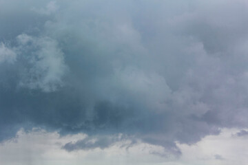 Fototapeta na wymiar Heavy rain thunderstorm dark storm clouds wind in Germany.