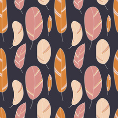 Simple feathers in a muted colors on a dark blue background. Seamless pattern for textile and paper.