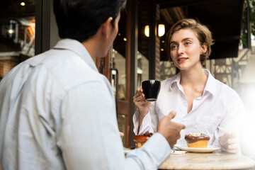 Business people enjoy lunch meal and dessert at restaurant management discussion for new projects. Consultant in casual restaurant cafe, young small business startup entrepreneur.