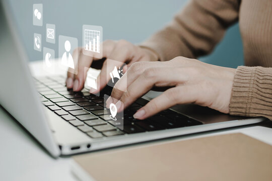 Financial. people hand using laptop computer with virtual graphic icon diagram on desk at home office, digital marketing, work from home, business finance, internet network technology concept