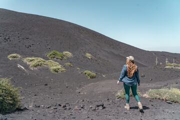 Woman hiking on Mount Etna. It's a active vulcano in Sicily.