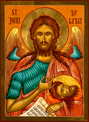Byzantine Style Orthodox Icon depicting St. John the Baptist, the Angel of the Desert, holding the severed head of St. John the Baptist.