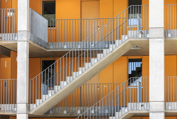 Staircase Outdoor. Facade with Stairs and metal Railings of Residential Apartmets Building. Fire escape stair concrete.