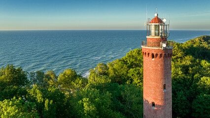 Lighthouse by Baltic sea in sunny day, Poland.