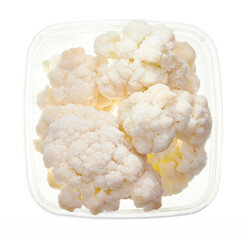 Cauliflower in plastic container. Top view of raw vegetables isolated on white background. Preparing vegetables for freezing. Storage for winter storage in trays