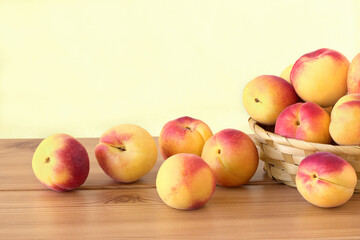 Apricots in wicker basket on the table