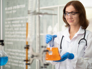 Chemist works in hospital pharmacology science research lab. Woman medical scientist or researcher analyzing innovative virus protective vaccines in health care biology laboratory. Medicine discovery.