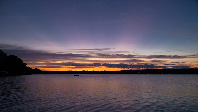 Dawn colors in clouds over lake
