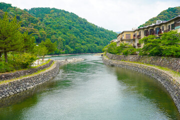 Fototapeta premium Uji river and To no Shima, Tachibanajima Island in Uji, Kyoto, Japan