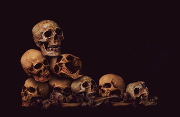 Awesome pile of skull human and bone on black cloth background, concept of scary crime scene of...