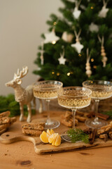 Fototapeta na wymiar Champagne glasses in the Christmas interior