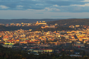Fototapeta na wymiar View of the city of Brno - Czech Republic - Europe. In the middle is the dominant Spilberk. The city is illuminated by the setting sun.