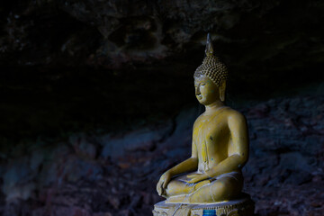 The Buddha image is located in a beautiful and peaceful cave.
