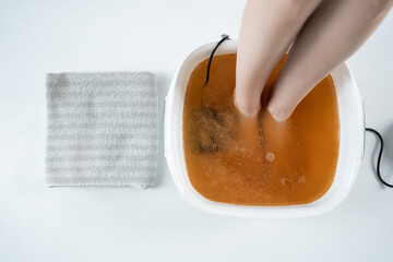 procedure of ionic detox foot bath machine in spa beauty center isolated - obrazy, fototapety, plakaty