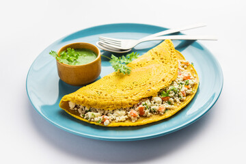 Paneer stuffed Besan chilla or Cheela made using chickpea flour with cottage cheese stuffing