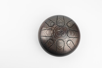 glucophone instrument  for playing music.  Sanskrit OM